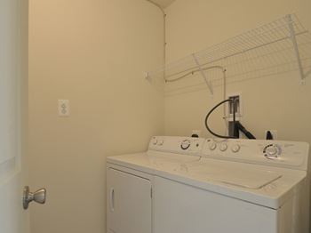 Laundry room with a washer and dryer at The Pointe at Manorgreen Townhomes, Baltimore, MD 21220